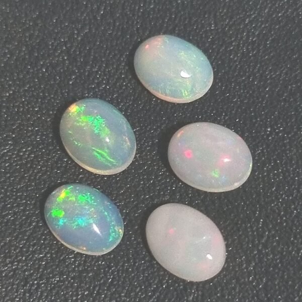 6.01-carat natural opal set (5 pieces) - oval cut gemstones with stunning play-of-colour, perfect for fine jewellery in Singapore.