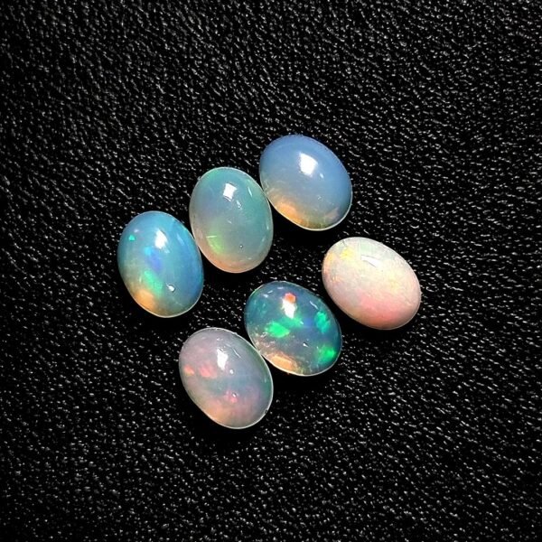 6.24-carat natural opal set (6 pieces) - oval cut gemstones with stunning play-of-colour, perfect for fine jewellery in Singapore.