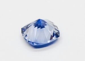A beautiful blue sapphire gemstone with intricate facets, showcasing its exquisite brilliance and color.