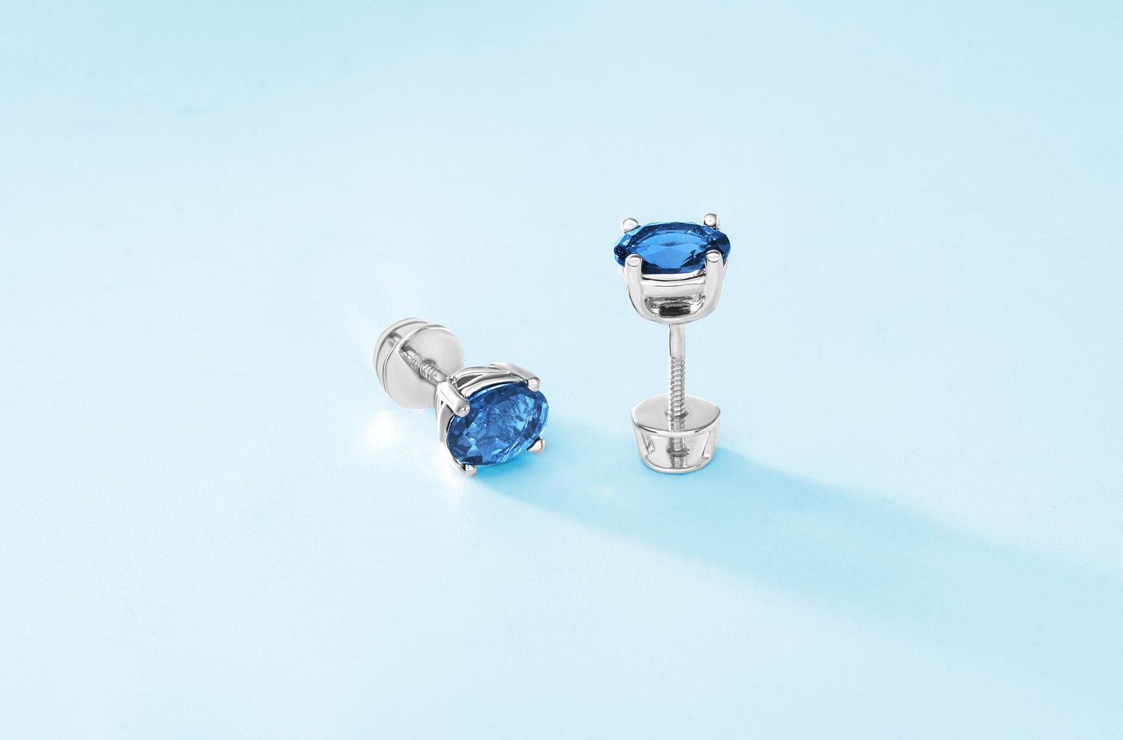Luxurious silver stud earrings with blue <a href=